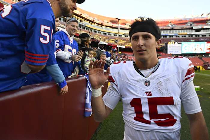 Giants quarterback Tommy DeVito celebrates with fans after New York's win over the Commanders in Week 11.